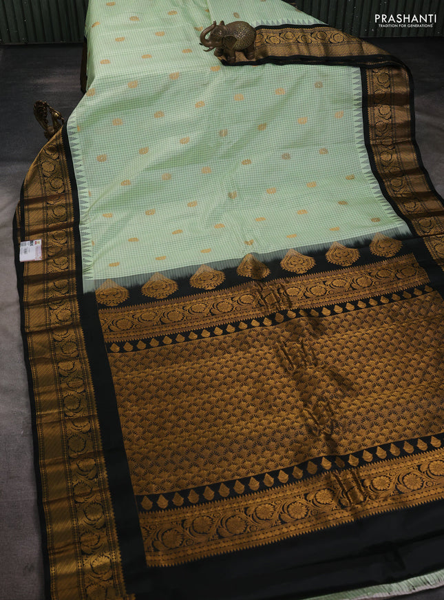 Pure gadwal silk saree pista green and black with allover zari checks & buttas and temple design zari woven border