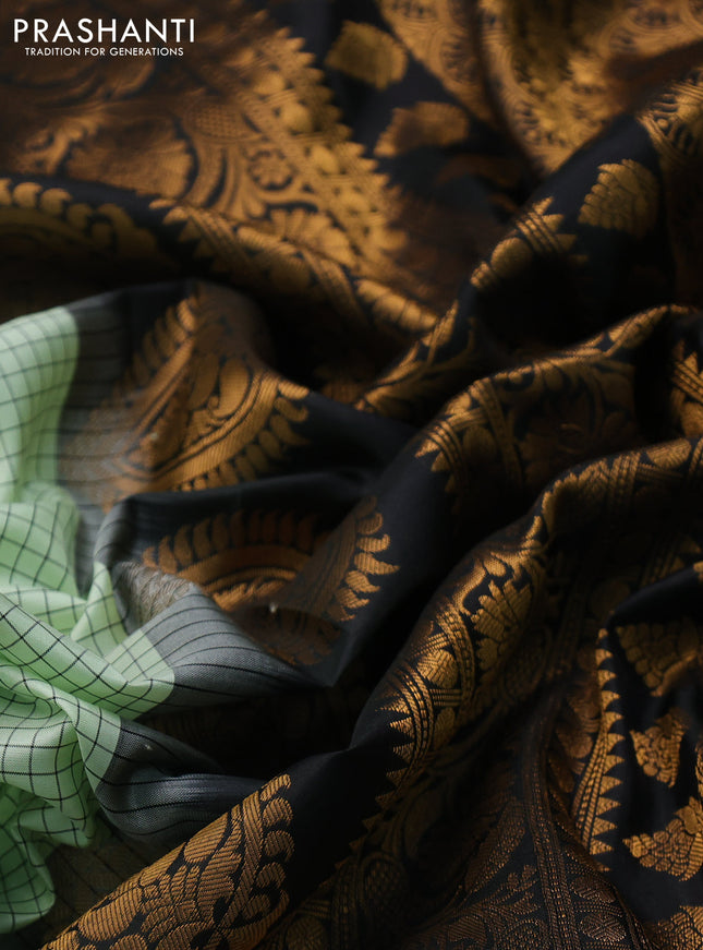Pure gadwal silk saree pista green and black with allover zari checks & buttas and temple design zari woven border