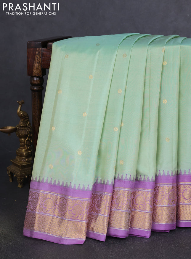 Pure gadwal silk saree pastel green and lavender with zari woven buttas and temple design zari woven korvai border