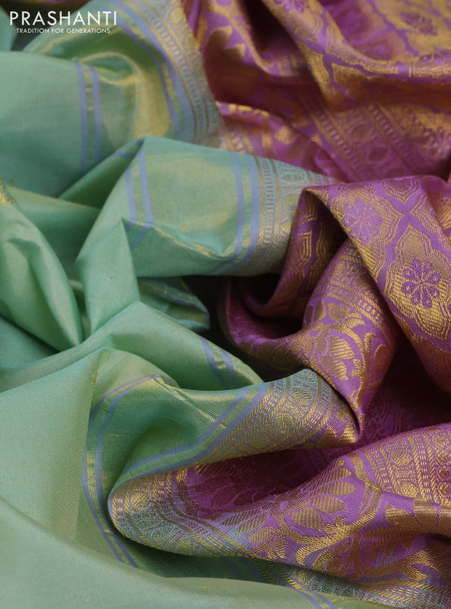 Pure gadwal silk saree pastel green and lavender with zari woven buttas and temple design zari woven korvai border
