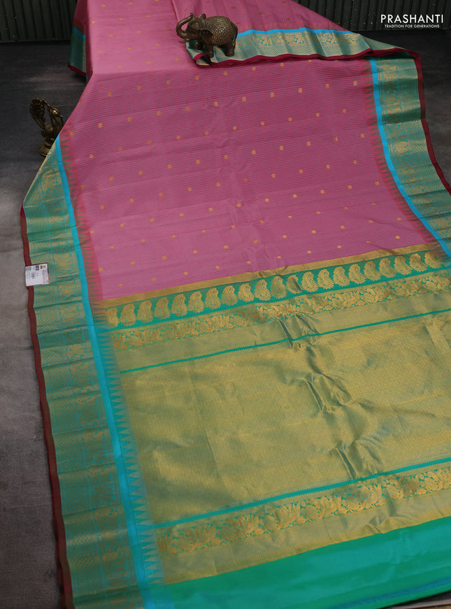 Pure gadwal silk saree peach pink shade and dual shade of teal bluish green with allover checks & zari buttas and temple design zari woven border