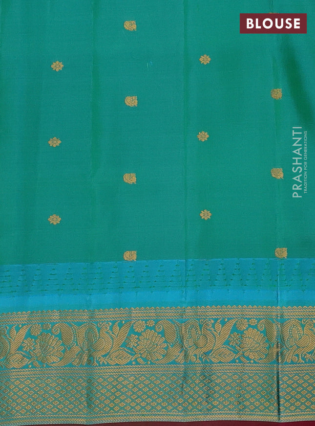 Pure gadwal silk saree peach pink shade and dual shade of teal bluish green with allover checks & zari buttas and temple design zari woven border