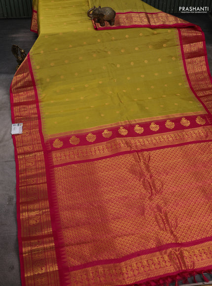 Pure gadwal silk saree mustard green and pink with allover zari checks & buttas and temple design zari woven border