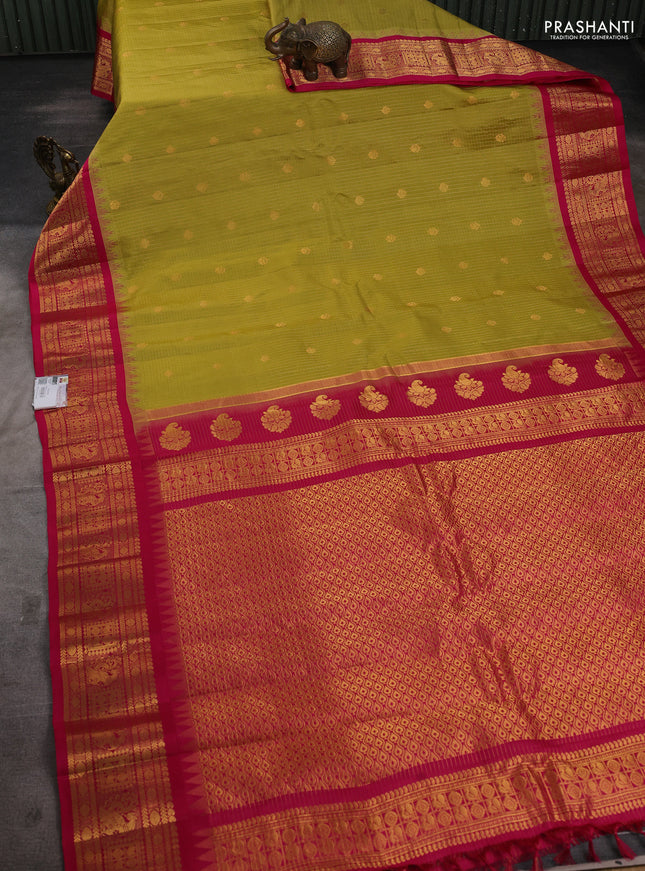 Pure gadwal silk saree mustard green and pink with allover zari checks & buttas and temple design zari woven border
