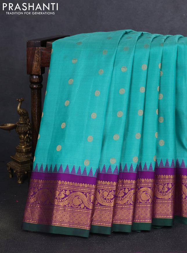 Pure gadwal silk saree teal green and purple with allover zari woven buttas and temple design zari woven border