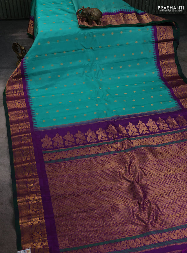 Pure gadwal silk saree teal green and purple with allover zari woven buttas and temple design zari woven border
