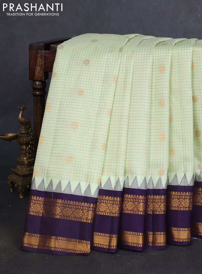 Pure gadwal silk saree mild pista green and deep purple with allover zari checks & buttas and temple design rettapet zari woven border