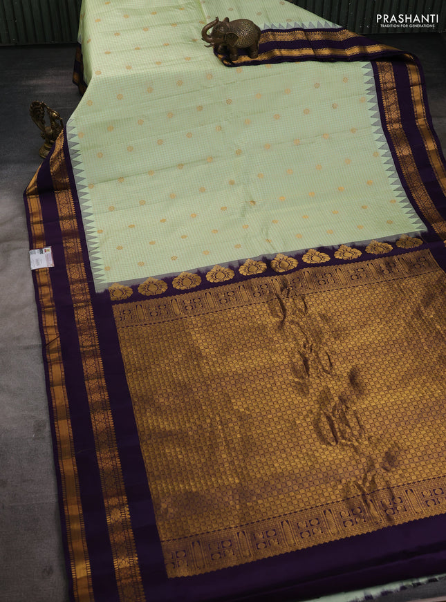 Pure gadwal silk saree mild pista green and deep purple with allover zari checks & buttas and temple design rettapet zari woven border