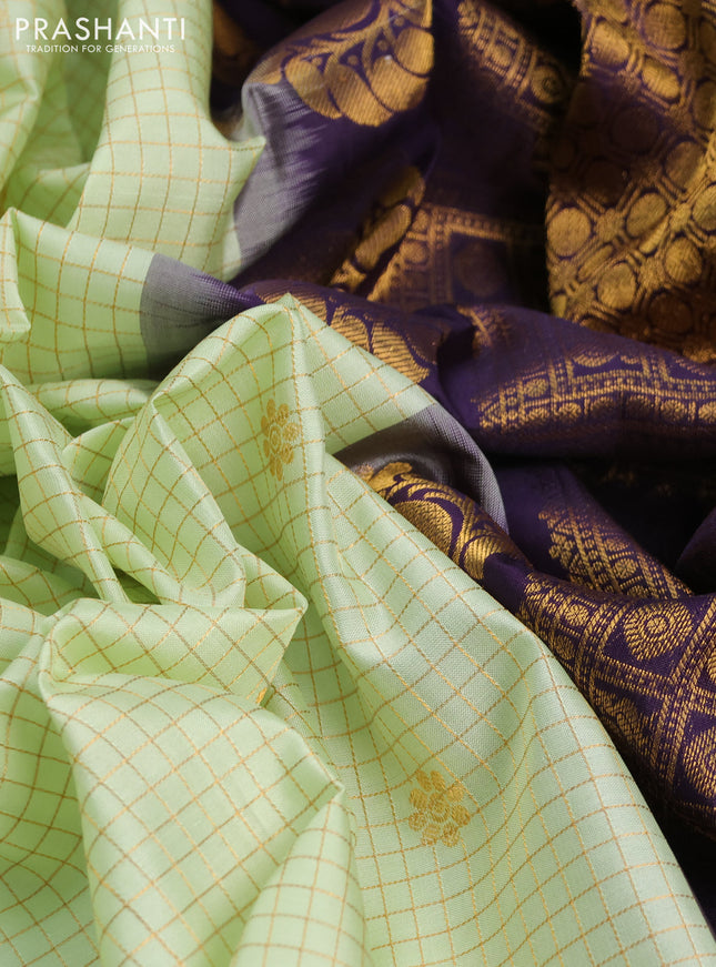Pure gadwal silk saree mild pista green and deep purple with allover zari checks & buttas and temple design rettapet zari woven border