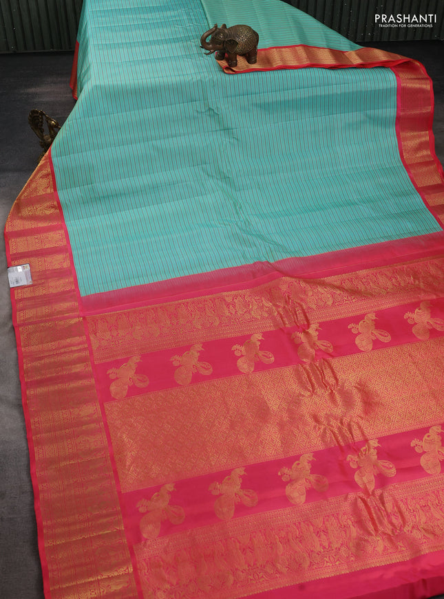 Pure gadwal silk saree teal blue and peach pink shade with allover stripe pattern and zari woven korvai border