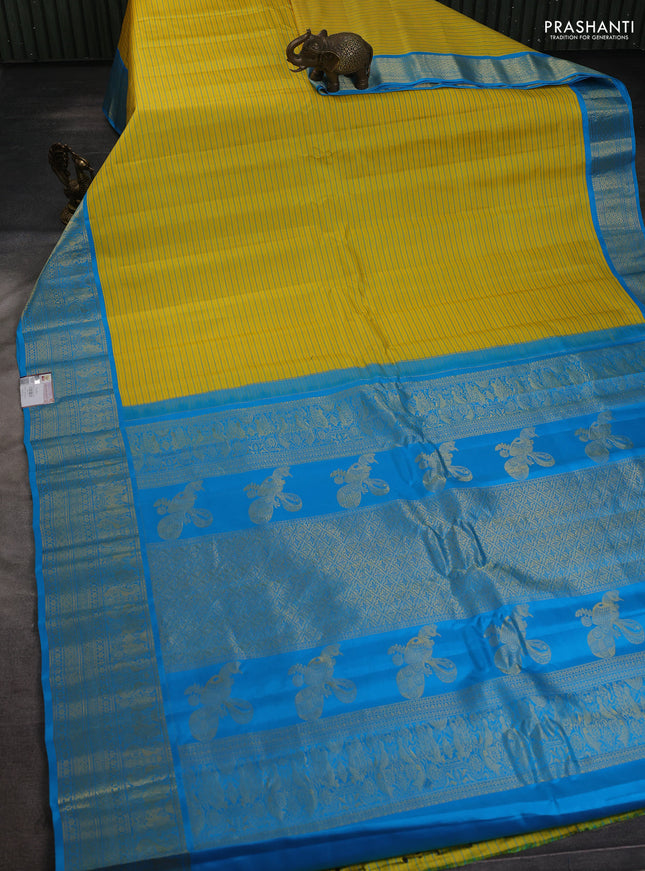 Pure gadwal silk saree yellow and cs blue with allover stripe pattern and zari woven korvai border