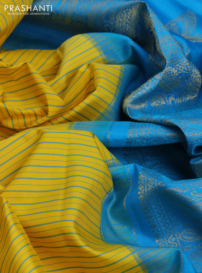 Pure gadwal silk saree yellow and cs blue with allover stripe pattern and zari woven korvai border