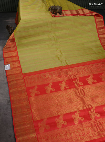 Pure gadwal silk saree lime green and orange with allover stripe pattern and zari woven korvai border