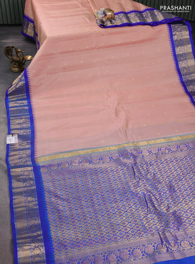 Pure gadwal silk saree pastel peach and blue with zari woven buttas and temple design zari woven border