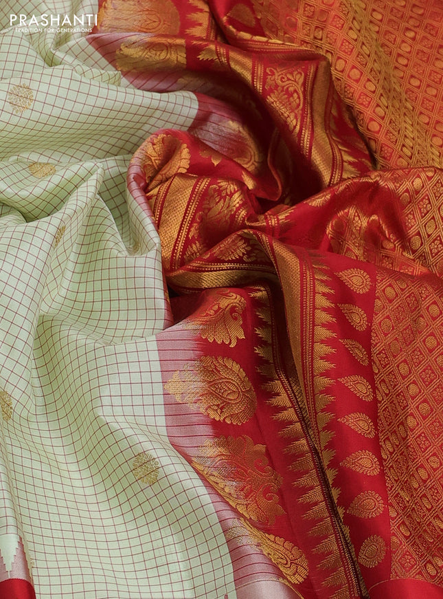 Pure gadwal silk saree mild pista green and orange with allover checks & zari buttas and temple design zari woven border