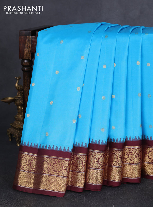 Pure gadwal silk saree light blue and brown with zari woven buttas and temple design zari woven border