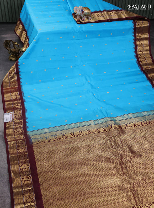 Pure gadwal silk saree light blue and brown with zari woven buttas and temple design zari woven border
