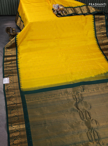Pure gadwal silk saree yellow and bottle green with zari woven buttas and temple design zari woven border