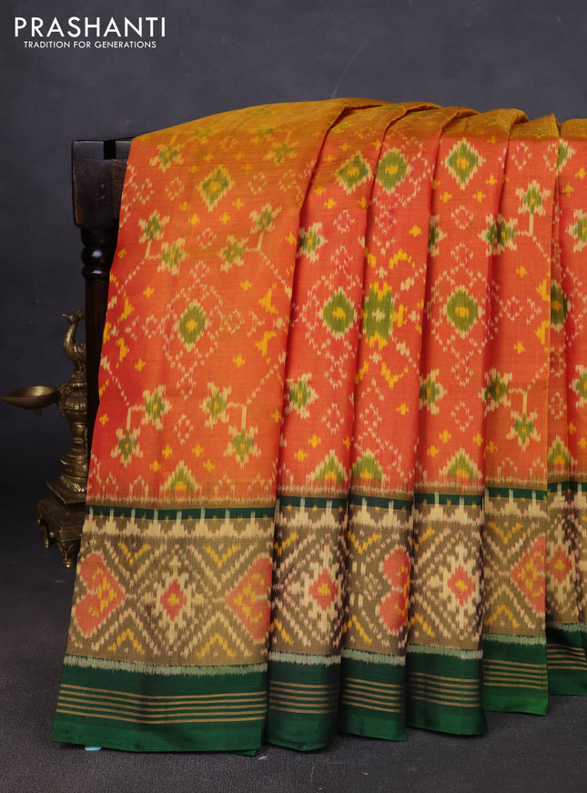 Rajkot patola silk saree dual shade of sunset orange and bottle green with allover ikat weaves and long ikat woven border