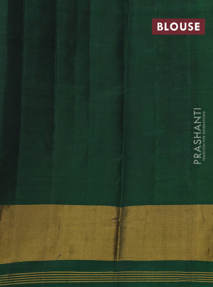 Rajkot patola silk saree dual shade of sunset orange and bottle green with allover ikat weaves and long ikat woven border