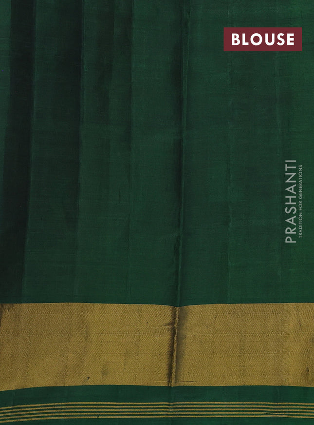 Rajkot patola silk saree dual shade of sunset orange and bottle green with allover ikat weaves and long ikat woven border