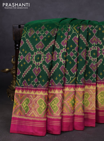 Rajkot patola silk saree green and pink with allover ikat weaves and ikat woven border