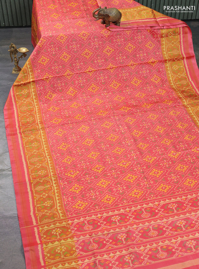 Rajkot patola silk saree peach pink shade with allover ikat weaves and ikat woven border