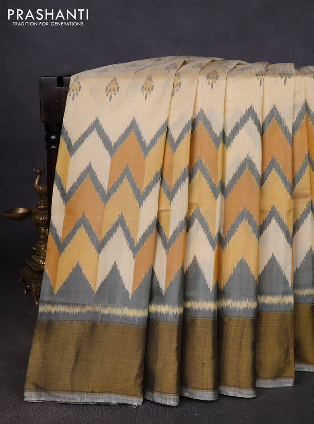 Rajkot patola silk saree cream and grey yellow with allover ikat butta weaves and ganga jamuna border