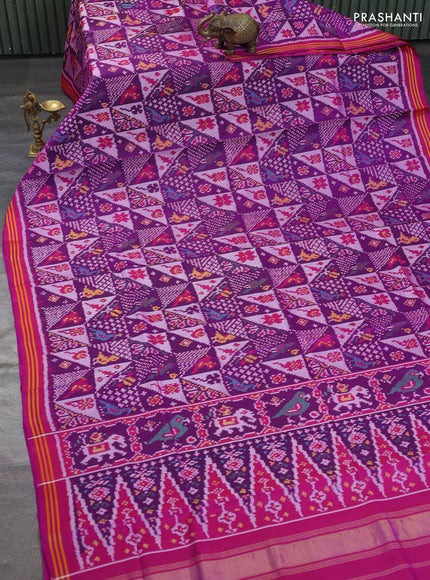 Rajkot patola silk saree purple and darl magenta pink with allover ikat weaves and ikat woven border