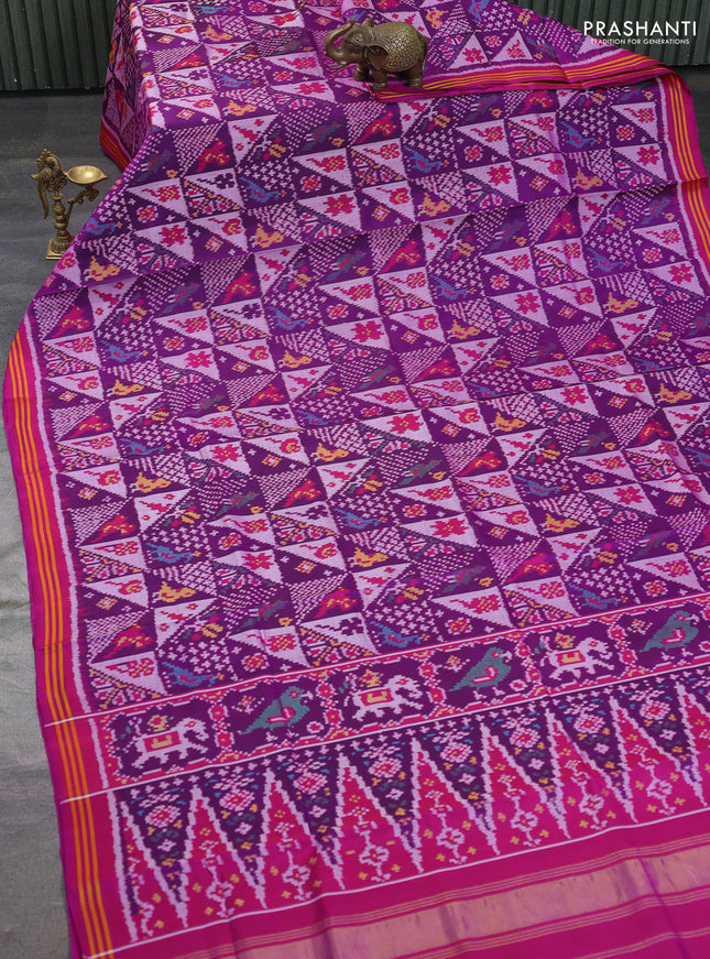 Rajkot patola silk saree purple and darl magenta pink with allover ikat weaves and ikat woven border