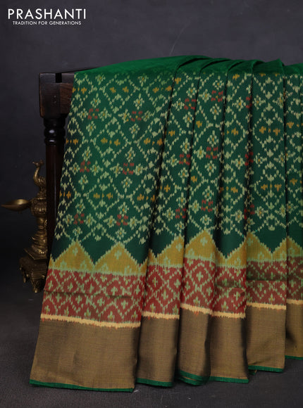 Rajkot patola silk saree bottle green and dark mustard maroon with allover ikat weaves and ikat woven border