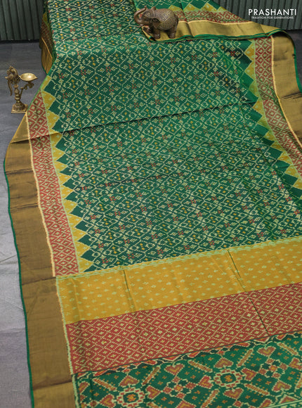 Rajkot patola silk saree bottle green and dark mustard maroon with allover ikat weaves and ikat woven border