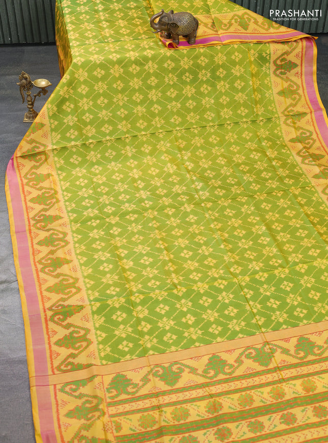 Rajkot patola silk saree light green and yellow with allover ikat weaves and ikat woven border