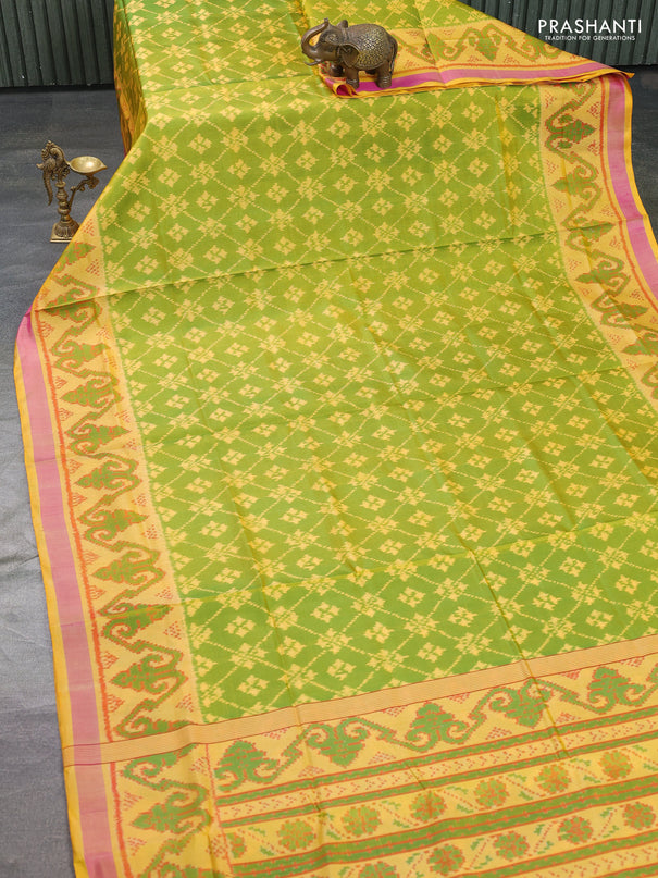 Rajkot patola silk saree light green and yellow with allover ikat weaves and ikat woven border