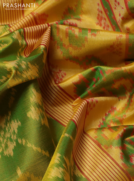 Rajkot patola silk saree light green and yellow with allover ikat weaves and ikat woven border