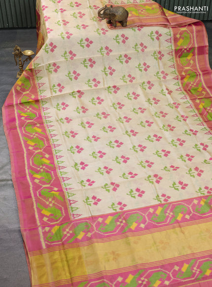 Rajkot patola silk saree cream and pink with allover ikat butta weaves and long ikat woven zari border