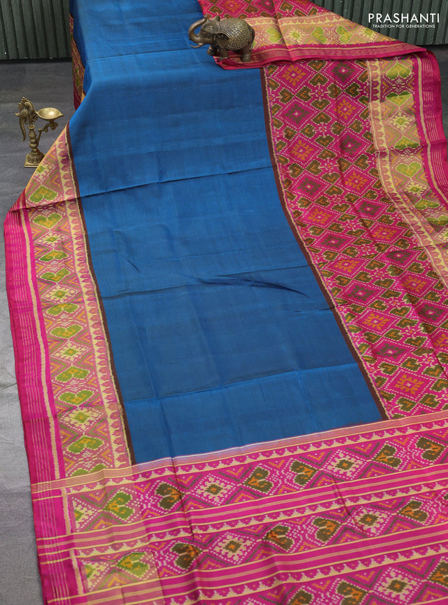 Rajkot patola silk saree peacock blue and pink with plain body and long ikat woven zari border