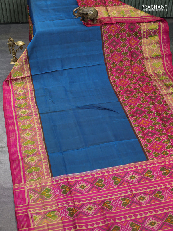 Rajkot patola silk saree peacock blue and pink with plain body and long ikat woven zari border