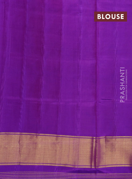 Rajkot patola silk saree dual shade of sunset orange and purple with allover ikat weaves and ikat woven border