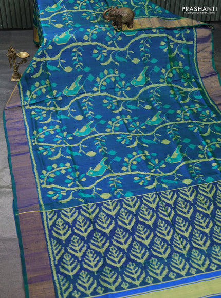 Rajkot patola silk saree dual shade of bluish green with allover ikat weaves & jute finish and zari woven border