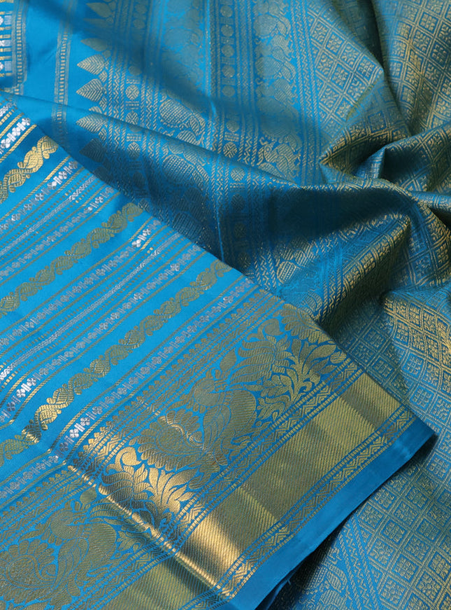 Pure kanchipuram silk saree teal blue with allover veldhari zari weaves and rich zari woven border