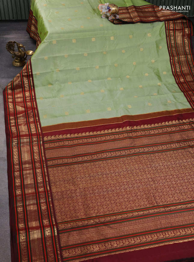 Pure kanchipuram silk saree pastel green and deep maroon with zari woven buttas and rich zari woven korvai border