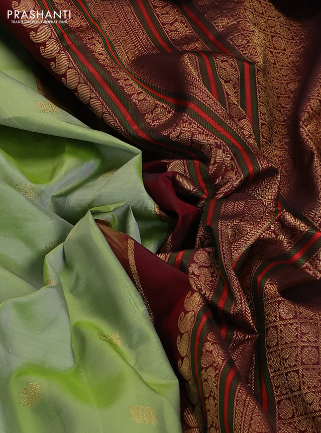 Pure kanchipuram silk saree pastel green and deep maroon with zari woven buttas and rich zari woven korvai border