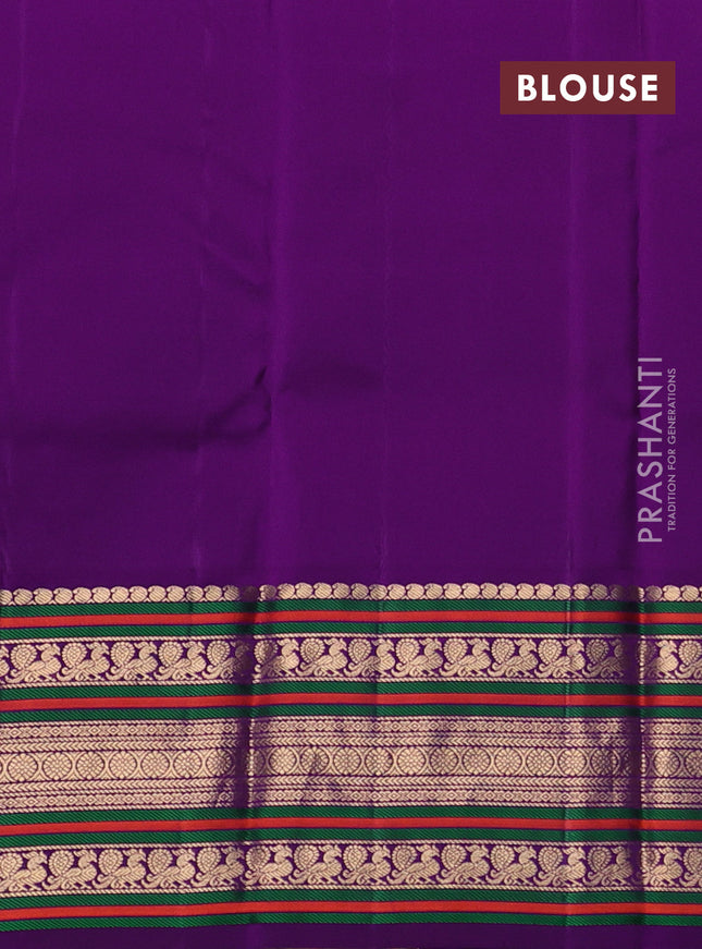 Pure kanchipuram silk saree dual shade of teal bluish green and purple with zari woven buttas and rich zari woven korvai border