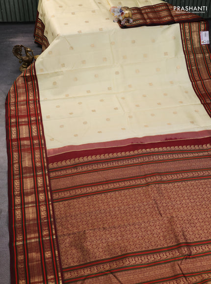 Pure kanchipuram silk saree cream and deep maroon with zari woven buttas and rich zari woven korvai border