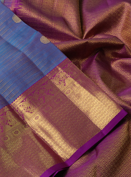 Pure kanchipuram silk saree dual shade of peacock blue and purple with allover vairosi pattern & zari buttas and rich zari woven border