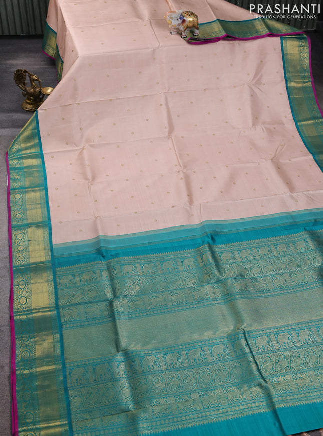 Pure kanchipuram silk saree pastel orange and teal green with zari woven buttas and zari woven korvai border