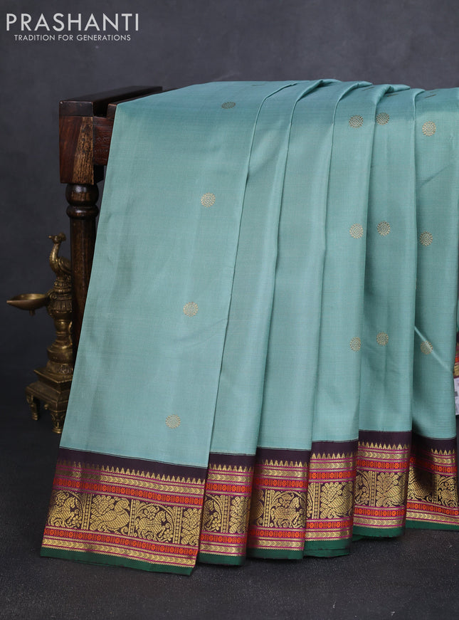 Pure kanchipuram silk saree pastel green and green coffee brown with zari woven buttas and zari woven korvai border