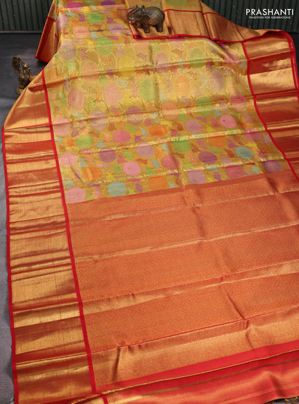 Pure kanchipuram tissue silk saree gold and red with allover zari woven brocade weaves and long zari woven border