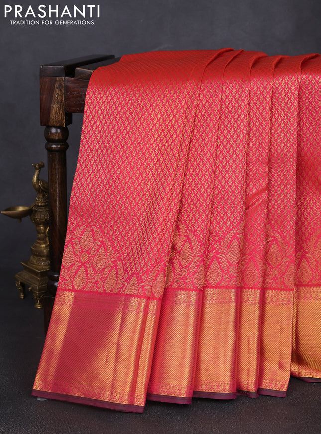 Pure kanchipuram silk saree dual shade of pinkish orange with allover zari woven brocade weaves and rich zari woven border